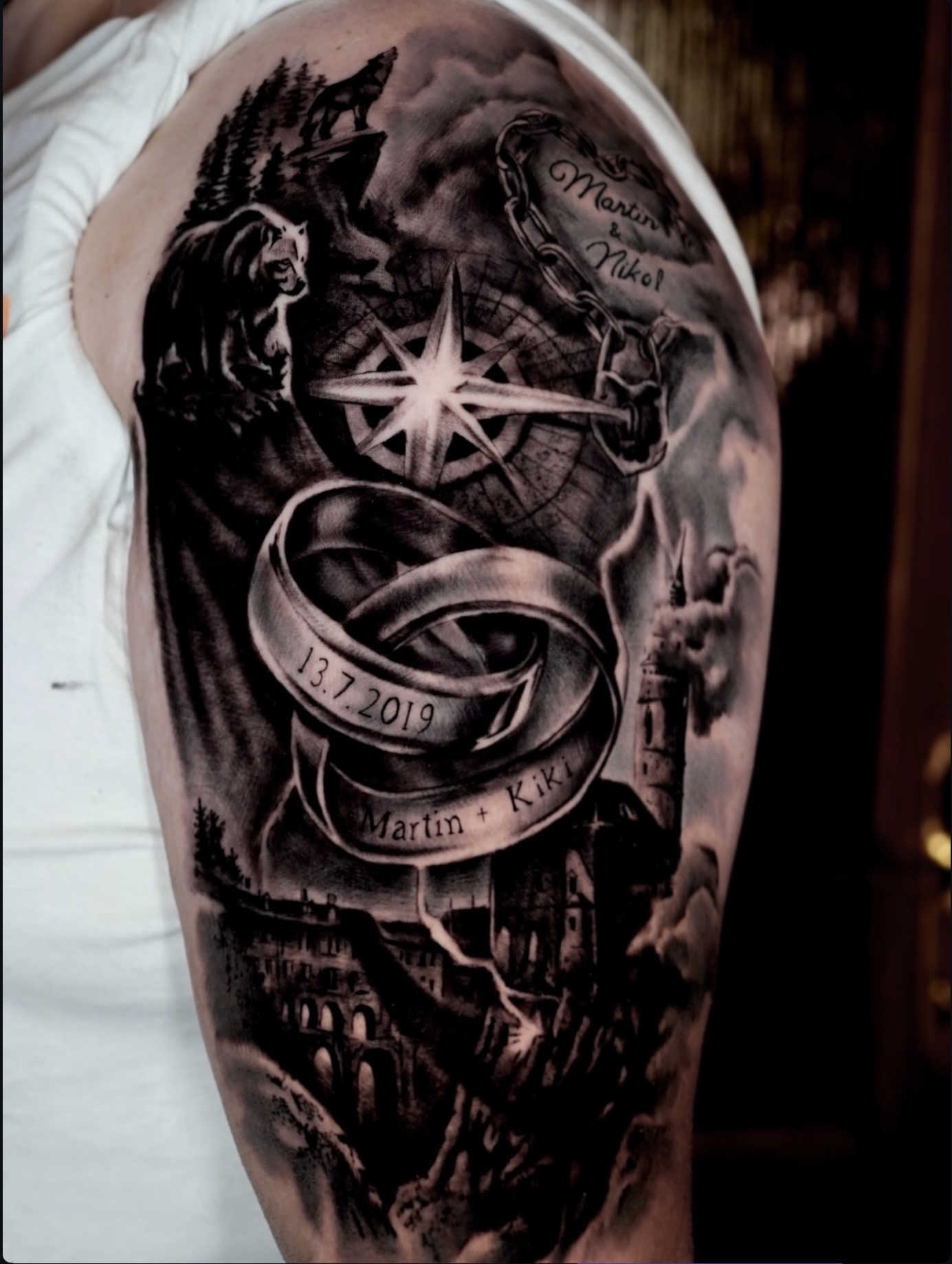 Black and grey compass realism arm tattoo by Henry D. Flores