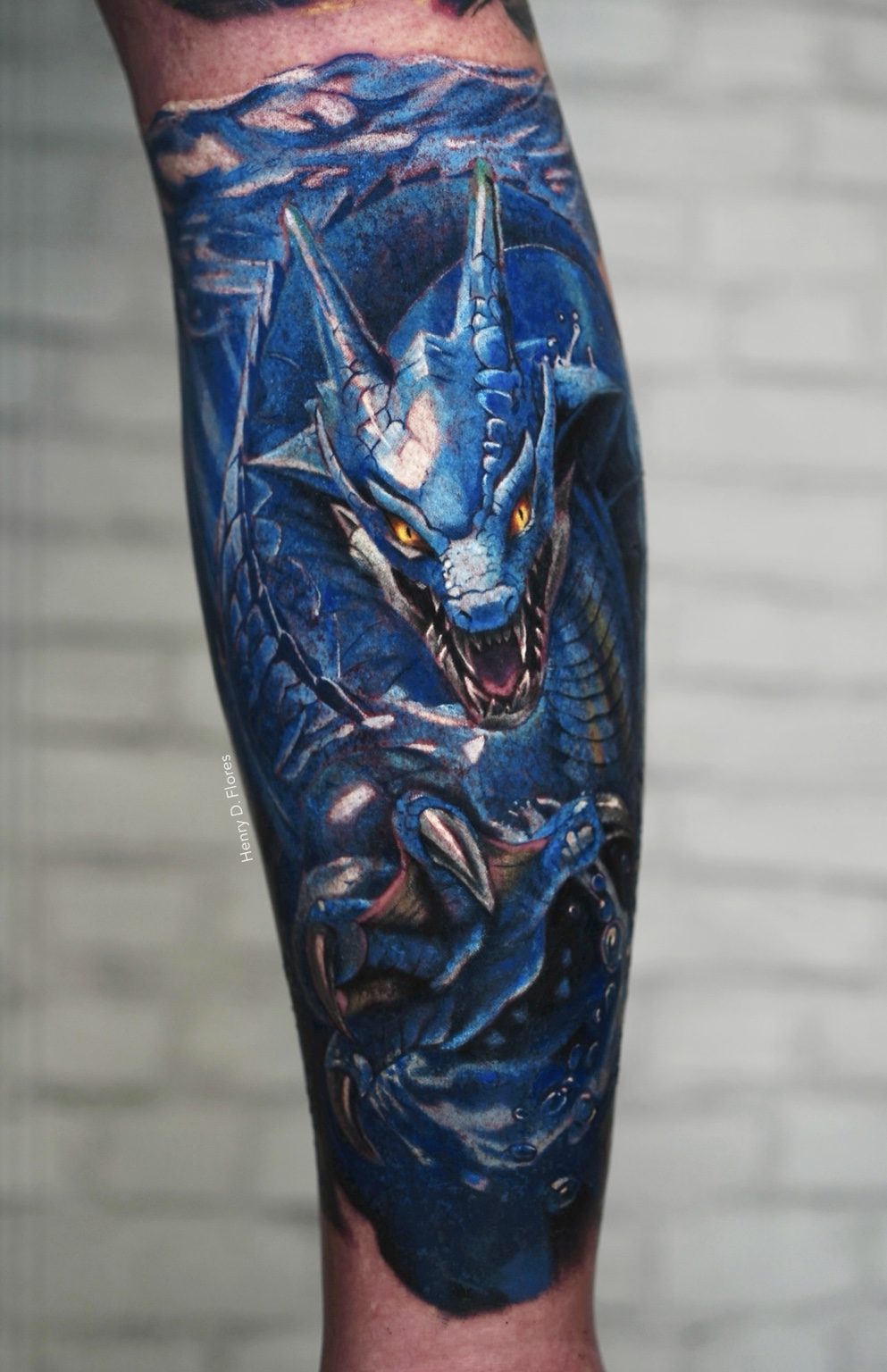 Blue dragon color realism forearm tattoo by Henry D. Flores