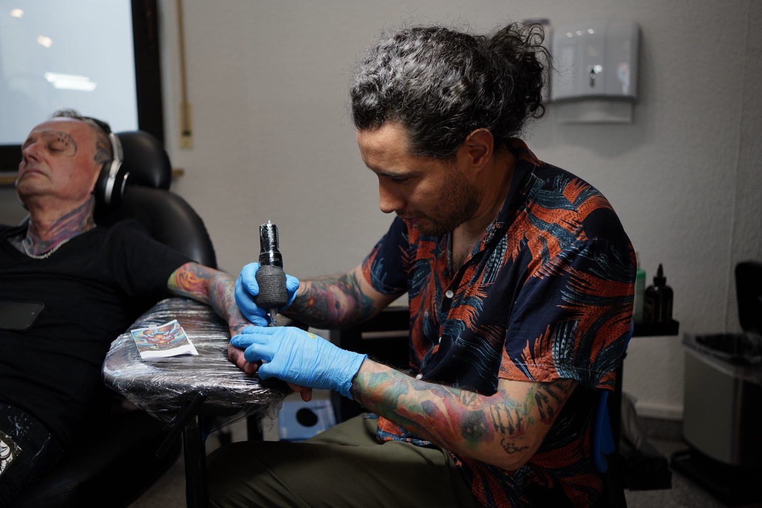 Henry D. Flores tattooing